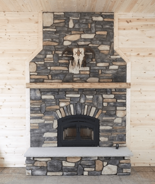 Gorgeous stone fireplace designed by Luce's Chimney & Stove Shop, serving Ohio, Michigan and Indiana.